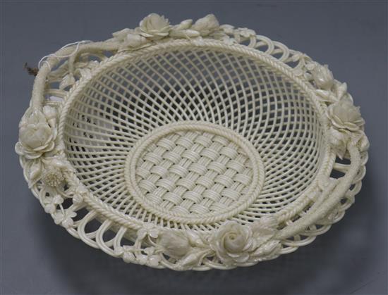 A Belleek white glazed circular basket, the pierced border modelled with roses diameter 22.5cm